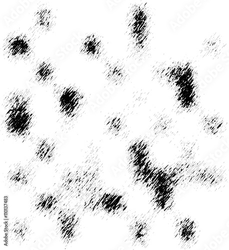 Black grunge spots on a white background. Vector background