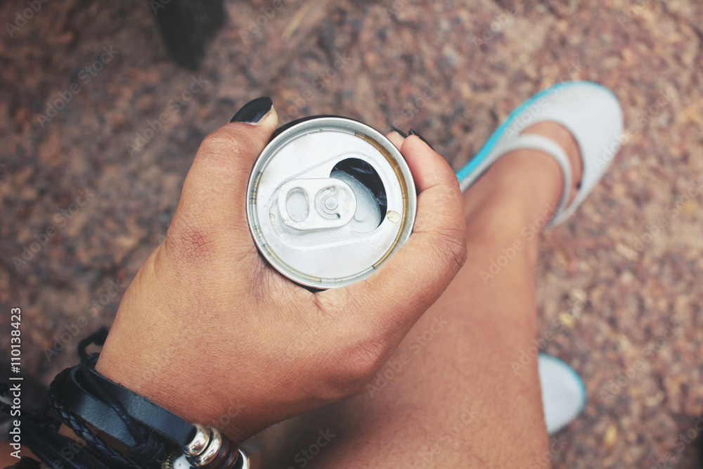 Fototapeta premium Woman drinking cola can