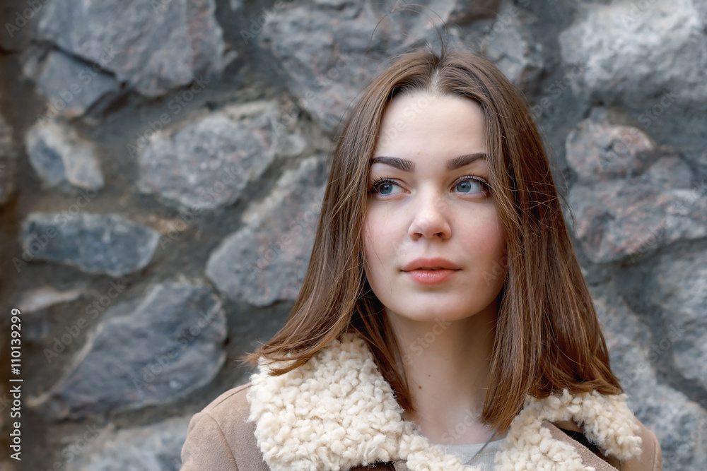 young attractive girl on the background of buildings young attractive girl on the background of buildings