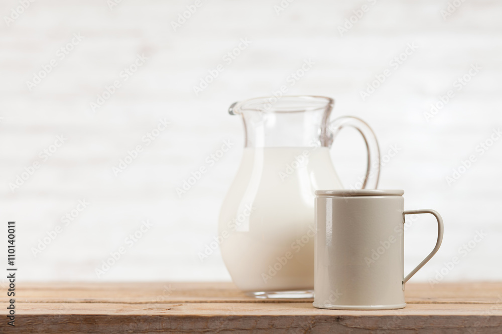 Milk jar on wooden table Milk jar on wooden table