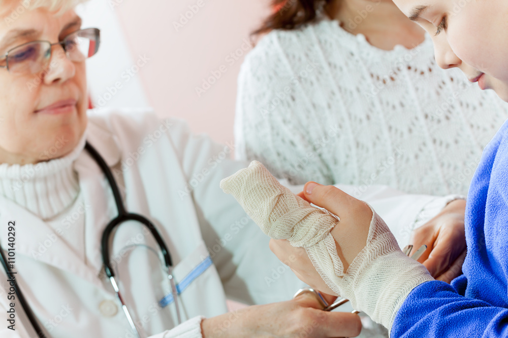 Doctor examining a child in a hospital Doctor examining a child in a hospital