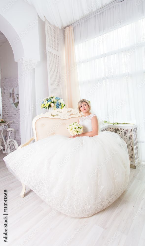 Beautiful bride in white wedding dress indoors Beautiful bride in white wedding dress indoors