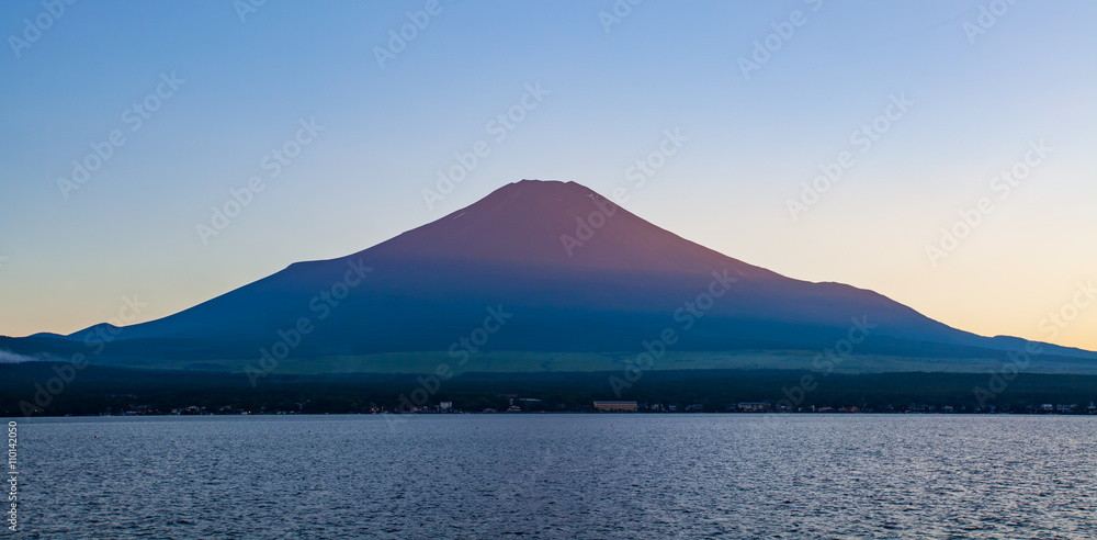 Red color at Top of Mountain Fuji during sunset at Yamanaka lake in summer