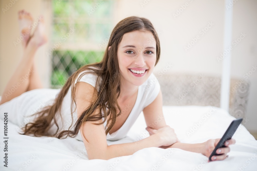Portrait of smiling woman holding mobile phone Portrait of smiling woman holding mobile phone