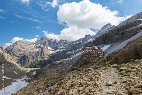 Hiking in Pyrenees mountains. Scenic shot of beautiful landscape with mountain hut near the Rolands Gap.