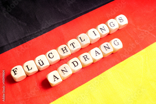 Flüchtlingsandrang, Buchstabenwürfel auf Deutschlandfahne