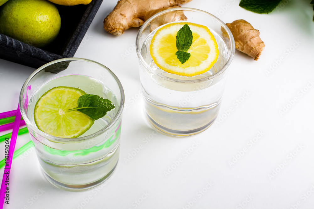 Ingredients for homemade lemonade, view from above. Lemon, lime and mint for refresh water. Ingredients for homemade lemonade, view from above. Lemon, lime and mint for refresh water.