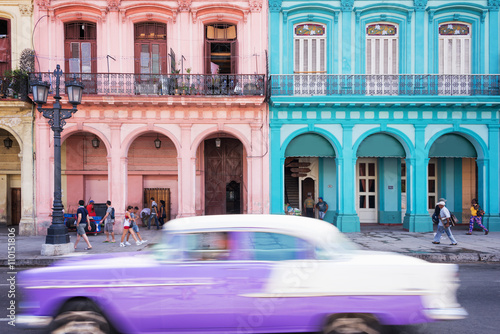 Classic vintage car and colorful colonial buildings in the main street of Old Havana, Cuba © Delphotostock