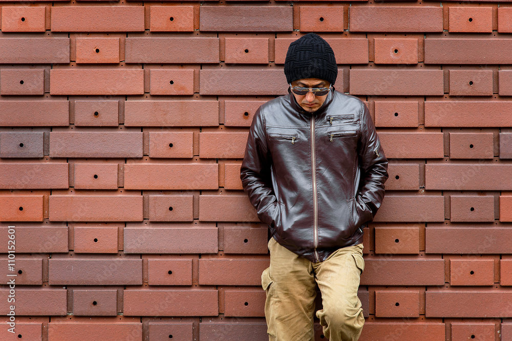 An Asian Man in a Brown Jacket An Asian Man in a Brown Jacket