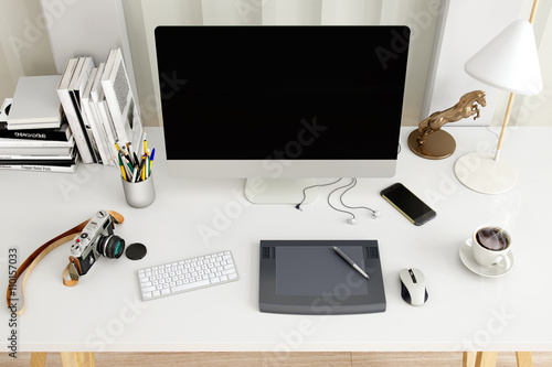 Creative desktop computer with drawing tablet on a desk in office