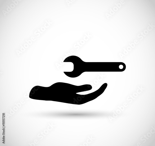 Hand with wrench vector icon