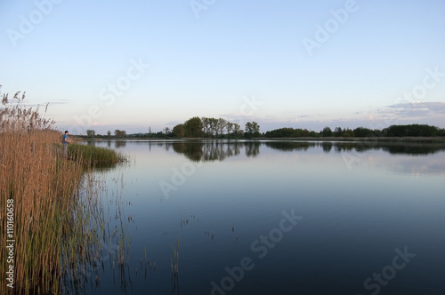 Angler on the lake in the evening © darekb22
