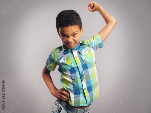Bild auf Leinwand A boy threatening with his fist.