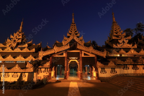 Building in front of Shwedagon Pagoda in the night  famous attraction in Yangon  Myanmar  Burma . Burmese architecture style.