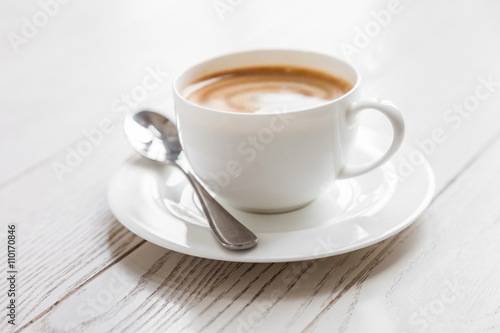 Fototapeta Naklejka Na Ścianę i Meble -  hot coffee in white cup on vintage wooden table