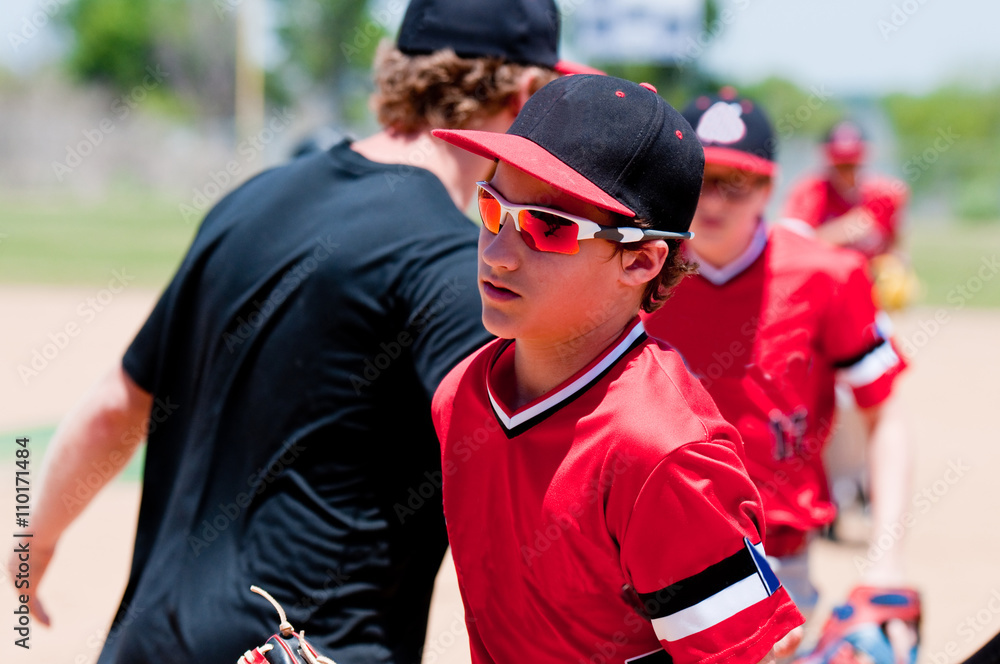 Obraz premium American youth baseball players and coach.