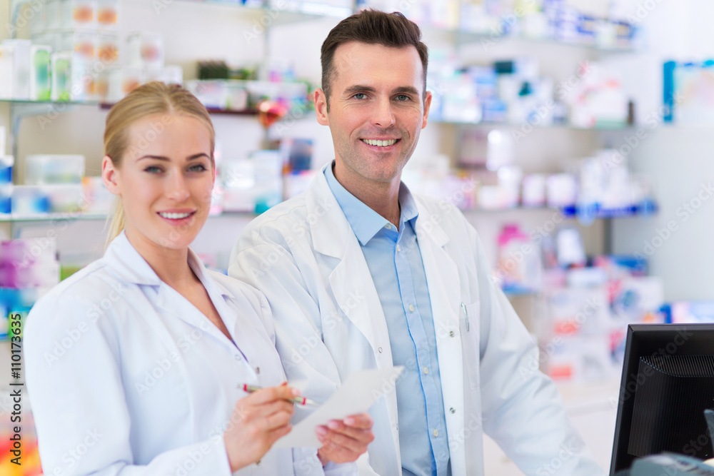 Female and male pharmacists in pharmacy
Female and male pharmacists in pharmacy