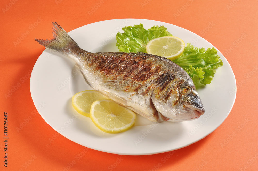 Dish with grilled fish gilthead bream Dish with grilled fish gilthead bream