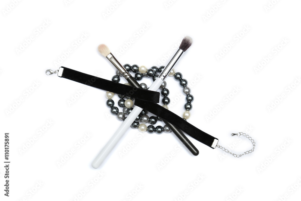 MakeUp brushes covered with black ribbon and beading isolated MakeUp brushes covered with black ribbon and beading isolated