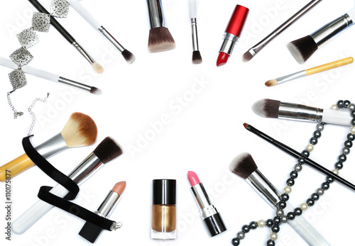 Makeup Brushes  lipsticks and nail polish isolated on white background