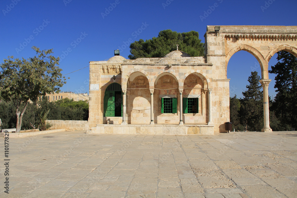 Arched colonnade and small building along the square on the Temple Mount in Jerusalem, Israel.