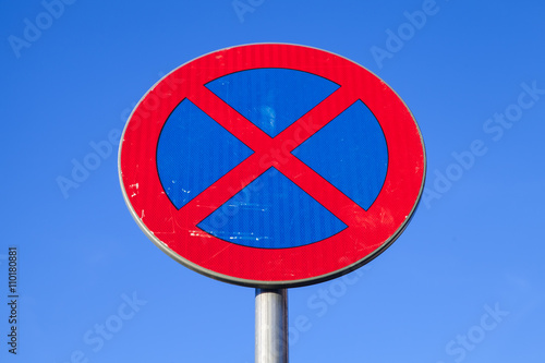 Standing is prohibited. Road sign over blue sky