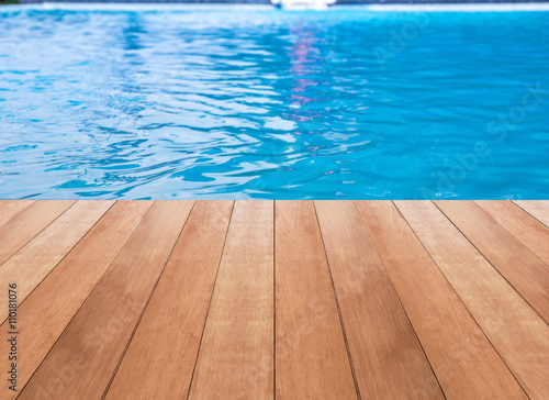 Swimming pool and wooden deck ideal for backgrounds © Thanakorn Thaneevej