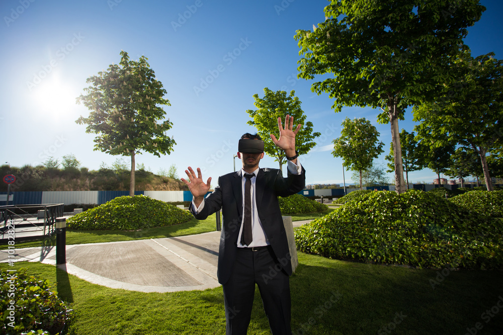 Businessman using virtual reality glasses Businessman using virtual reality glasses