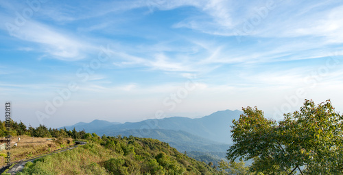 Mountains, trees, sky and cloud background.