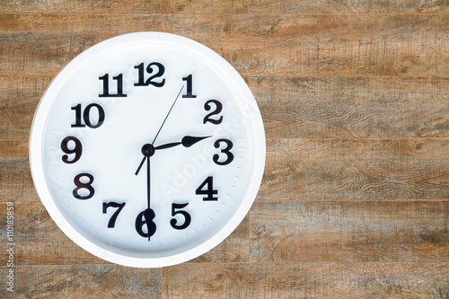 Clock on wood background