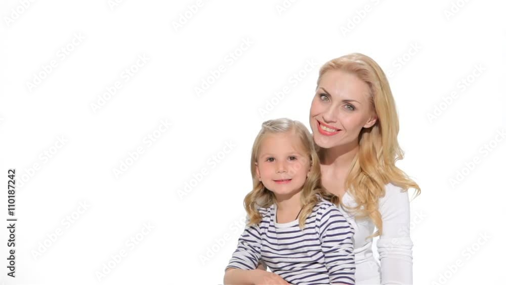 Little girl and mother make silence gesture Little girl and mother make silence gesture