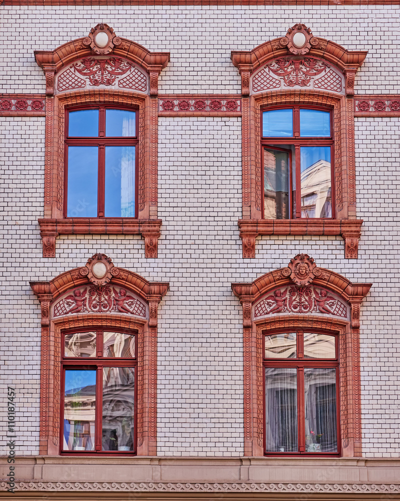 four vintage art window on brick wall pattern