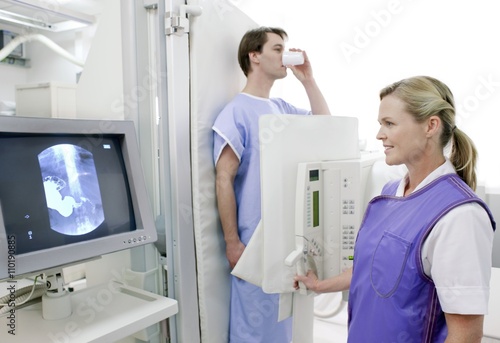 Man swallowing barium during an X-ray photo