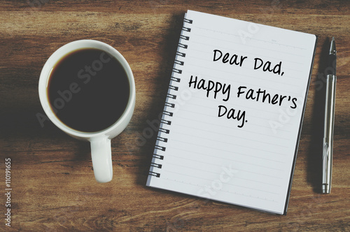 Happy father's day on notepad with coffee and pen retro style