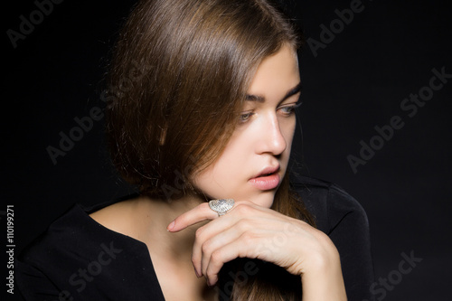 Portrait of a girl with diamonds on black dackground photo