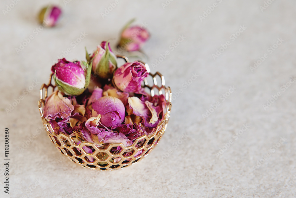 Flower tea rose buds on grey table Flower tea rose buds on grey table