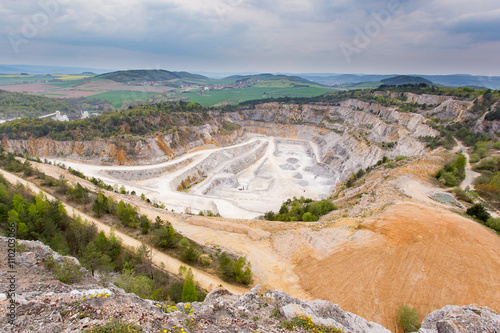 Limestone mine in Koneprusy, Czech Republic. Deep opencast mines leave great environmental impact.
