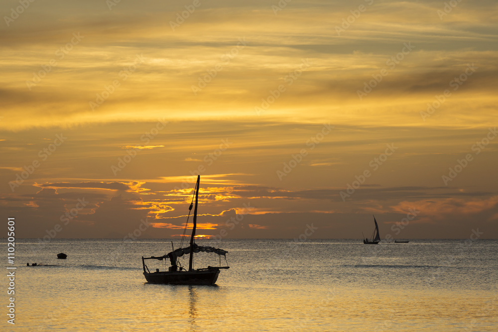 Fototapeta premium Traditional Fisherman Dhow Boat during sunset, Zanzibar, Tanzani