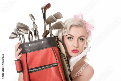 Unhappy retro girl peeking out from behind red golf bag, isolate