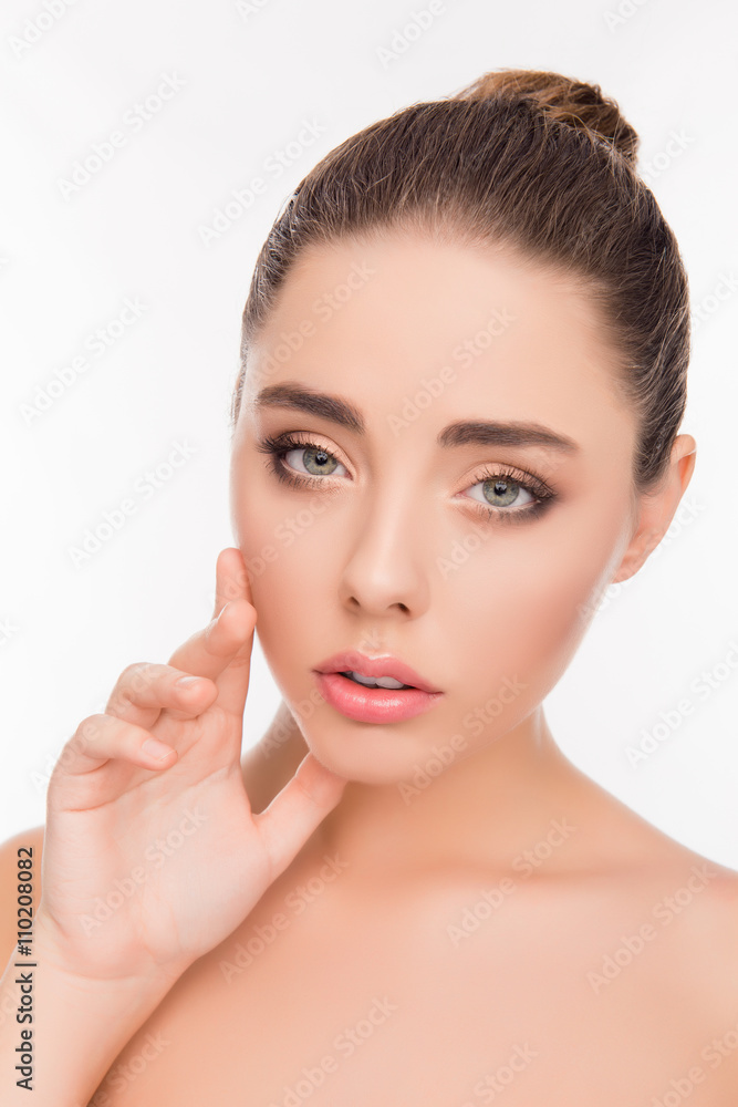 Portrait of pretty woman with perfect skin touching her face Portrait of pretty woman with perfect skin touching her face