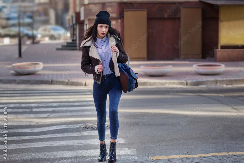 Outdoor lifestyle portrait of pretty young girl, wearing hipster swag grunge  style on urban background. Wearing hat and jeans with backpack. Spring  fashion woman. Toned style instagram filters. Stock Photo | Adobe
