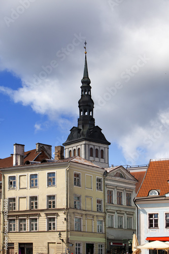 ancient houses and view on St. Nicholas' Church (Niguliste). Old city, Tallinn, Estonia ..