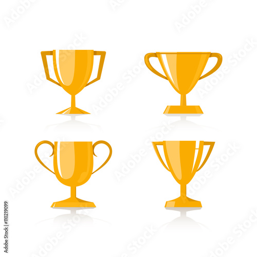 Set of four golden winner cups on grey background. 