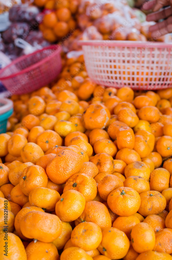 cloe up shot of orange being sell at the street fruit shop
