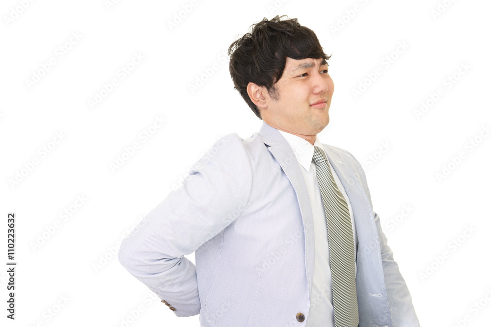 腰痛を訴えるビジネスマン