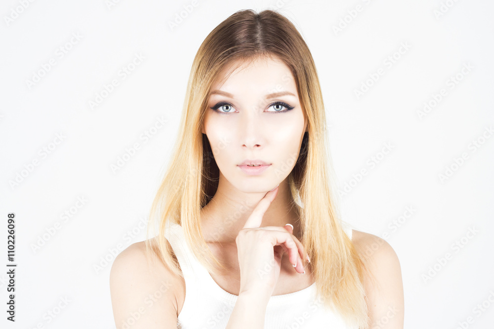 Beautiful woman with permanent make-up holding finger under her chin. Beautiful woman with permanent make-up holding finger under her chin.