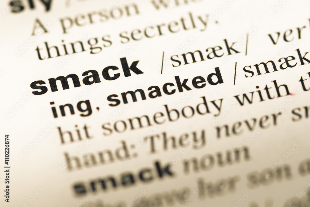 Close up of old English dictionary page with word smack Close up of old English dictionary page with word smack