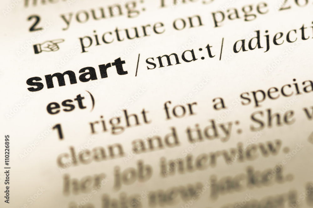 Close up of old English dictionary page with word smart Close up of old English dictionary page with word smart
