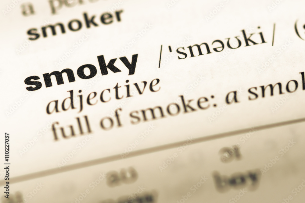 Close up of old English dictionary page with word smoky Close up of old English dictionary page with word smoky
