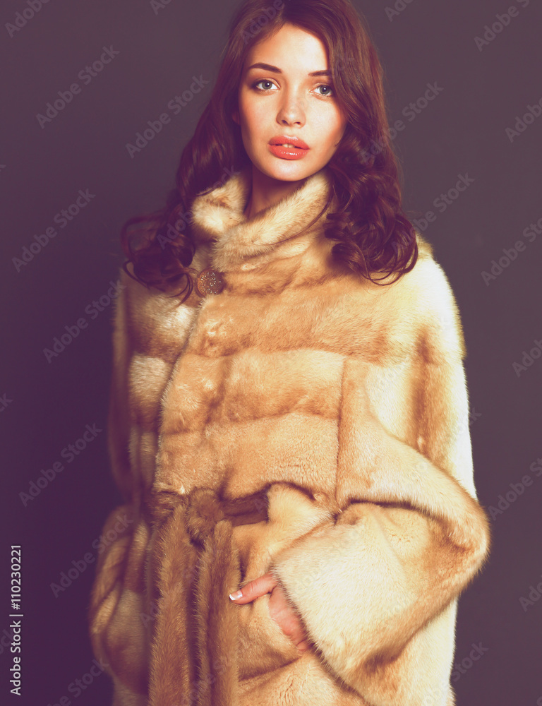 Portrait of a beautiful woman in jacket with fur. Portrait of a beautiful woman in jacket with fur.